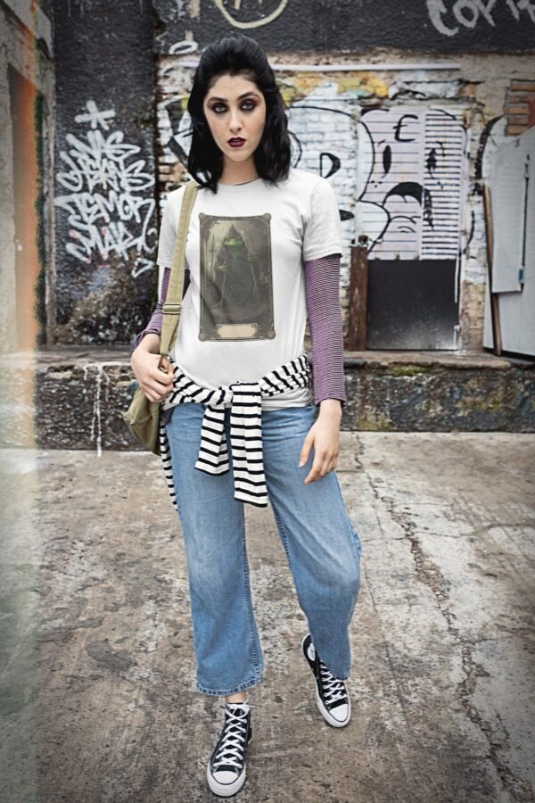 a woman standing in front of a graffiti covered wall