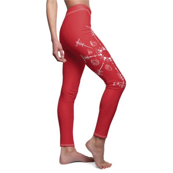 a woman wearing red leggings with hearts and arrows on them