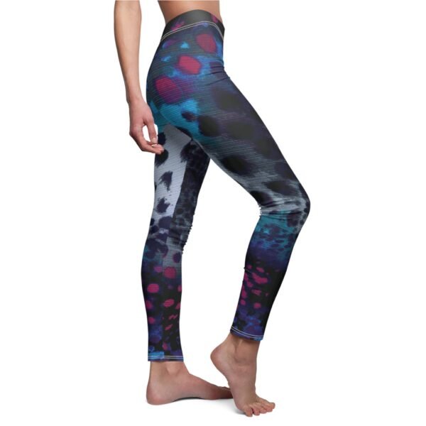 a woman wearing a colorful leggings with a pattern on it