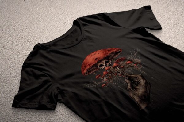 a black t - shirt with a picture of a hand holding a skull