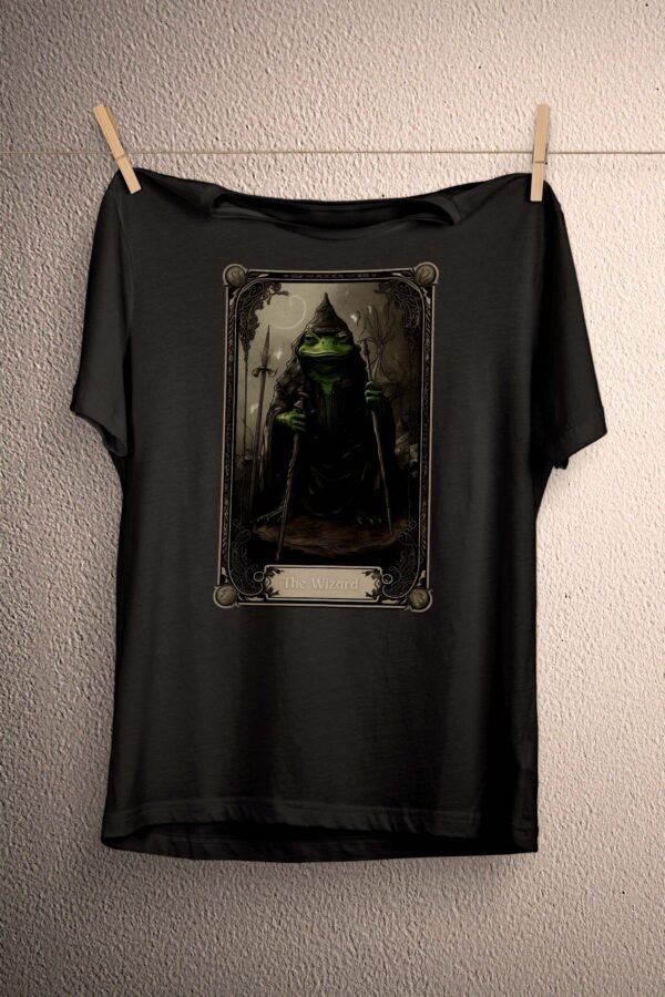 a t - shirt hanging on a clothes line with a picture of a green man