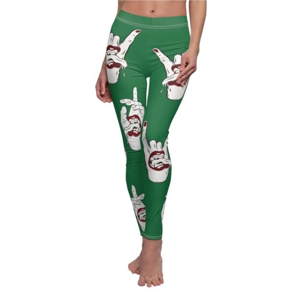 a woman wearing green leggings with a hand gesture painted on it