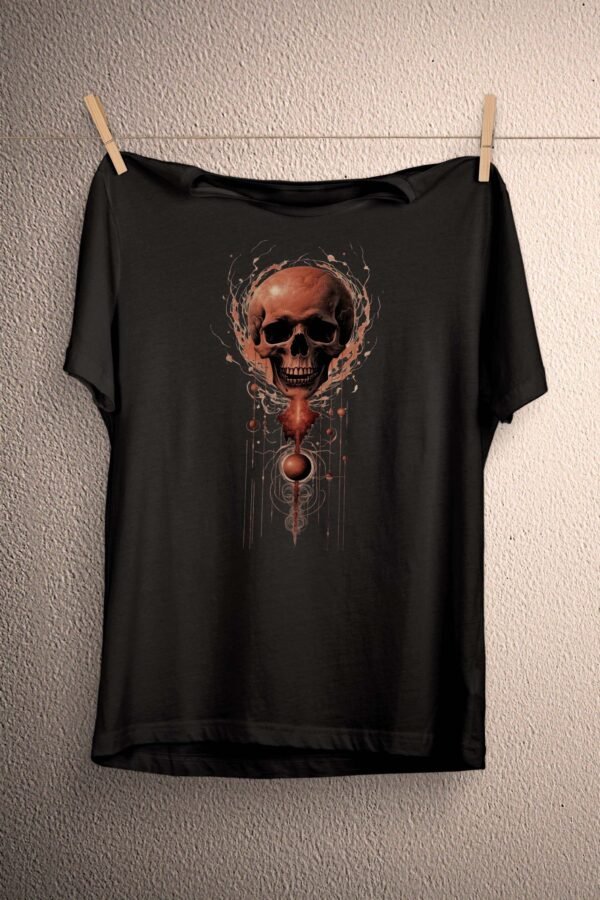 a black t - shirt with a skull on it hanging on a clothes line