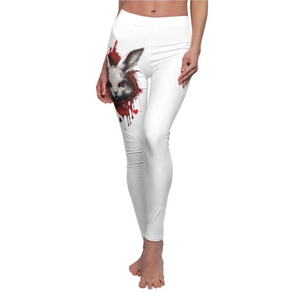 a woman wearing white leggings with a picture of a rabbit on it