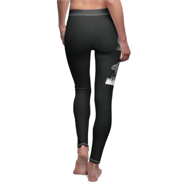 a woman's leggings with a black design on the side