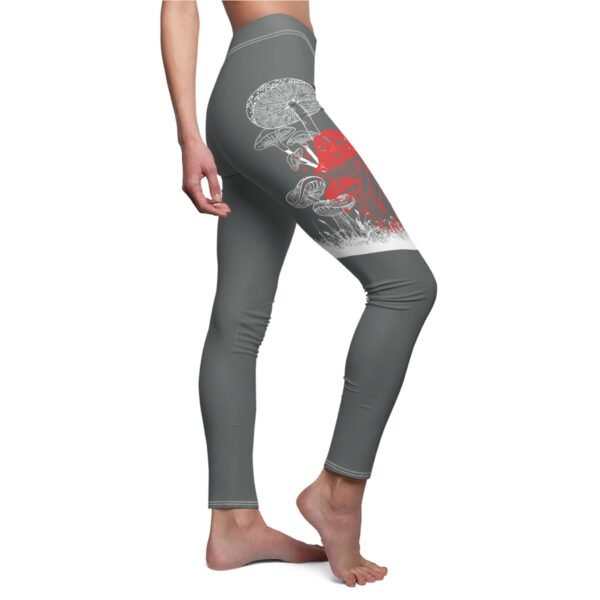 a woman in grey leggings with a red and white design on the side