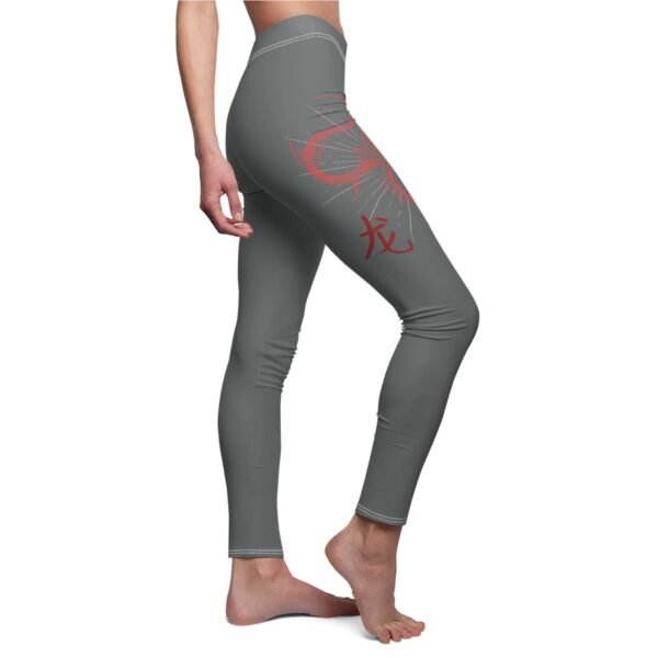 a woman in grey leggings with a red dragon on the side