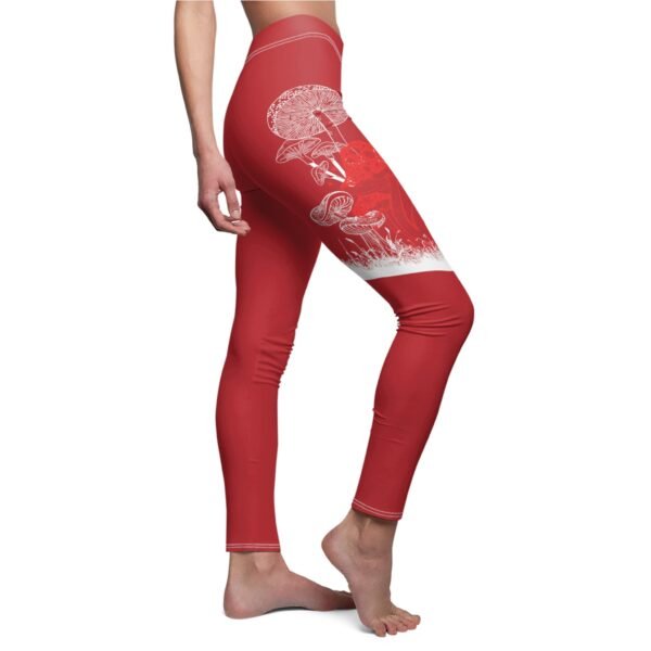 a woman in red leggings with a white design on the side