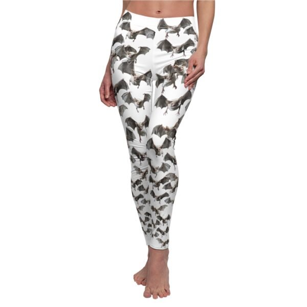 a woman in a white top and black and white dog print leggings