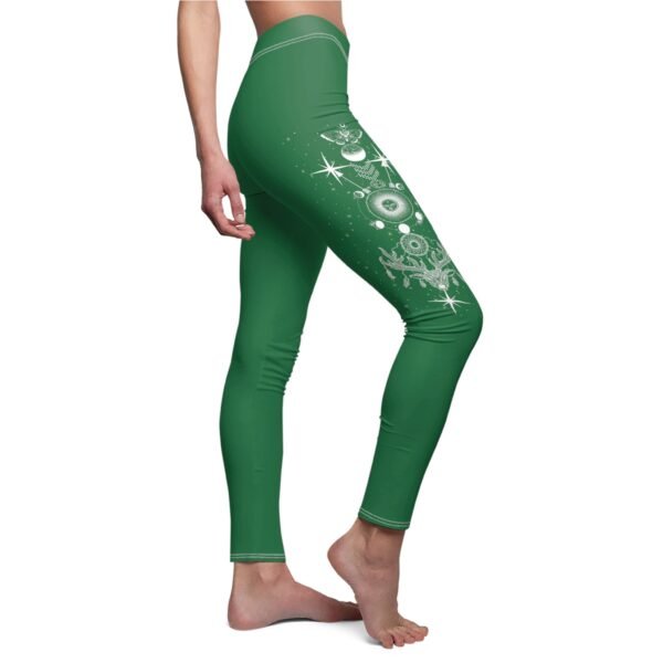 a woman in green leggings with a christmas tree on it