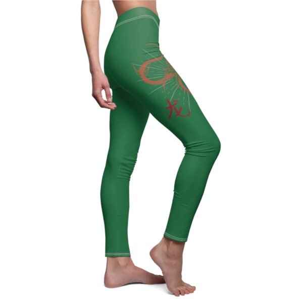 a woman in green leggings with a dragon on the side