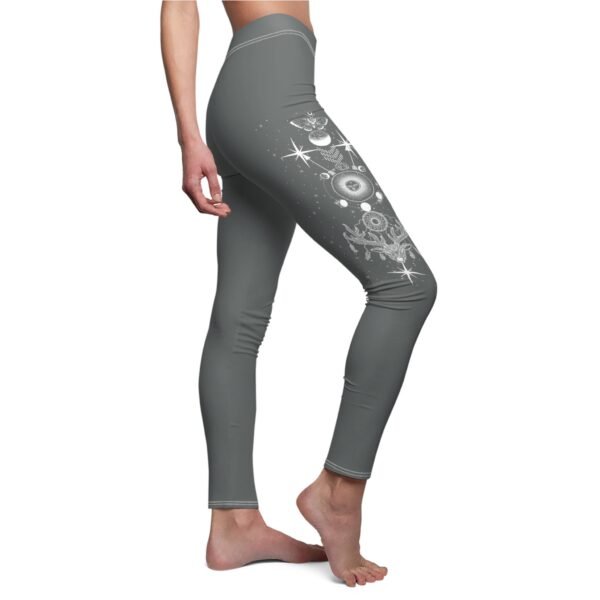 a woman in grey leggings with a space theme on the side